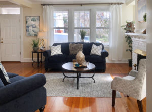 Living room with accents and furniture at a Home Staging Downtown Annapolis